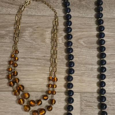 (2) Beaded Necklaces- One Black Beads and the other Amber Colored Beads