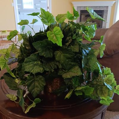 ROUND WOODEN END TABLE WITH STORAGE CABINET PLUS A FAUX PLANT