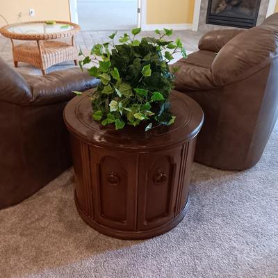 ROUND WOODEN END TABLE WITH STORAGE CABINET PLUS A FAUX PLANT