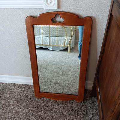 ANTIQUE CHEST OF DRAWERS AND A WALL MIRROR