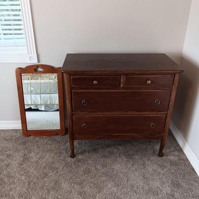 ANTIQUE CHEST OF DRAWERS AND A WALL MIRROR
