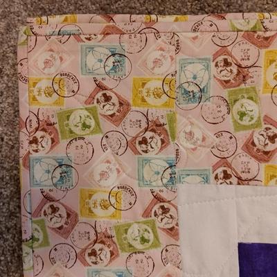 HANDMADE QUILT WITH POSTAGE STAMP MATERIAL PLUS A QUILTED WALL HANGING