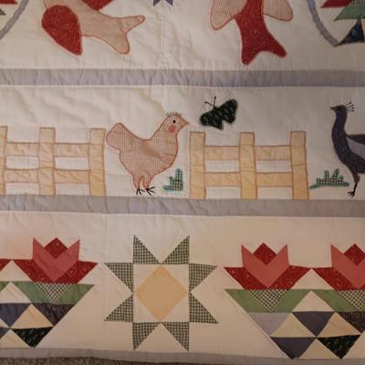 A FUN HANDMADE DETAILED QUILT