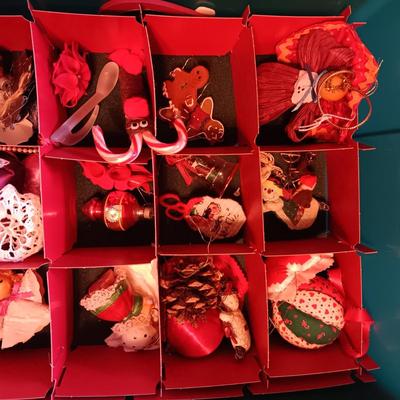 A VARIETY OF CHRISTMAS ORNAMENTS WITH AN ORGANIZING STORAGE TOTE
