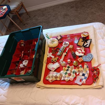 A VARIETY OF CHRISTMAS ORNAMENTS WITH AN ORGANIZING STORAGE TOTE