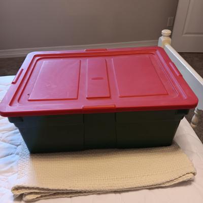 A VARIETY OF CHRISTMAS ORNAMENTS WITH AN ORGANIZING STORAGE TOTE