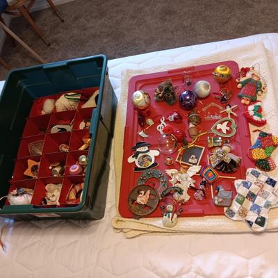 A VARIETY OF CHRISTMAS ORNAMENTS WITH AN ORGANIZING STORAGE TOTE