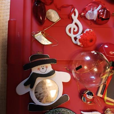 A VARIETY OF CHRISTMAS ORNAMENTS WITH AN ORGANIZING STORAGE TOTE