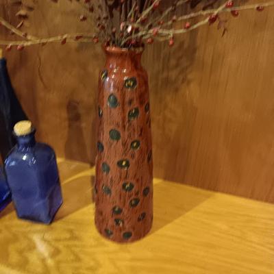 3 BLUE CORKED BOTTLES AND A CERAMIC VASE WITH FAUX FOLIAGE