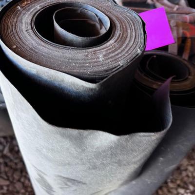 Two Partial Rolls of Tar Paper
