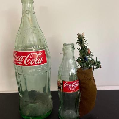 Pair of empty Coca-Cola glass bottles