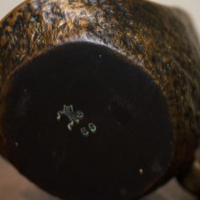 NORSE POTTERY CANDLE HOLDER W/ BACK REFLECTOR AND HANDLE.