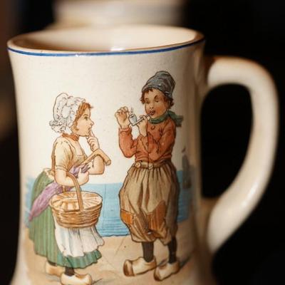 EARLY 1900'S ROSEVILLE CHILDREN CHARACTER MUG TRANSFER ON YELLOW GLAZED POTTERY MUGS