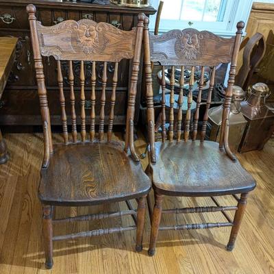Set of 2 Oak Chairs with North Wind Carving