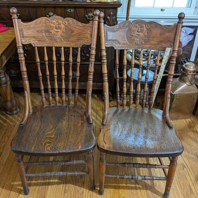 Set of 2 Oak Chairs with North Wind Carving