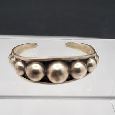 Sterling Silver Cuff Bracelets, One With Amber