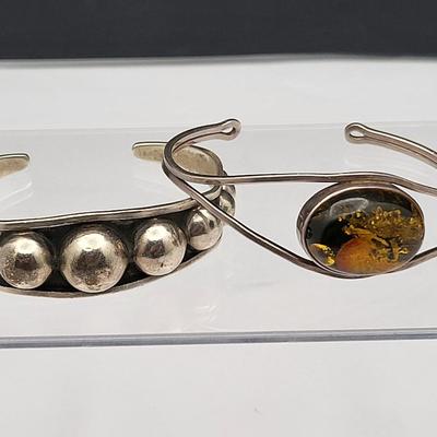 Sterling Silver Cuff Bracelets, One With Amber