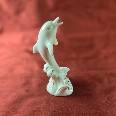 Sale Photo Thumbnail #61: This auction lot is for a very nice Lenox China Dolphin.  This cute and stylish dolphin is jumping up to greet you just like the "Flipper" of 50s television.  It stands 4-inches tall.  Great gift idea for the right person - maybe just for you.