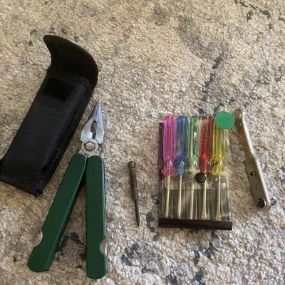 Handy pliers, small screwdrivers and ratchet