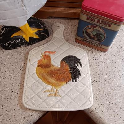 WOODEN ROOSTER, CERAMIC CUTTING BOARD AND A TIN
