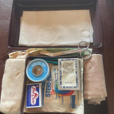 Brown Tupperware first aid kit