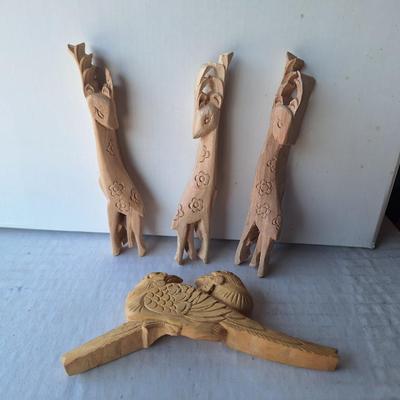4 wooden animal figurines