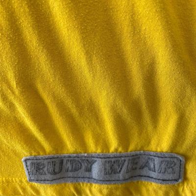 Rudy wear gold T-shirt