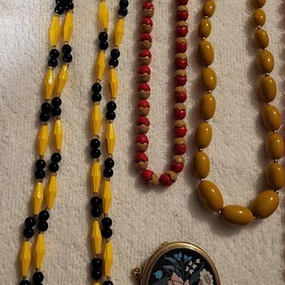 COLORFUL NECKLACES AND A LOCKET