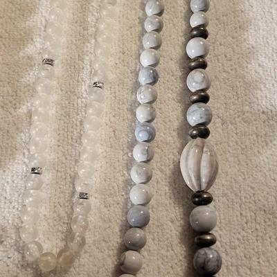 A VARIETY OF COSTUME JEWELRY AND A SASAKI QUARTZ GLASS CLOCK