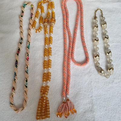 4 COSTUME NECKLACES