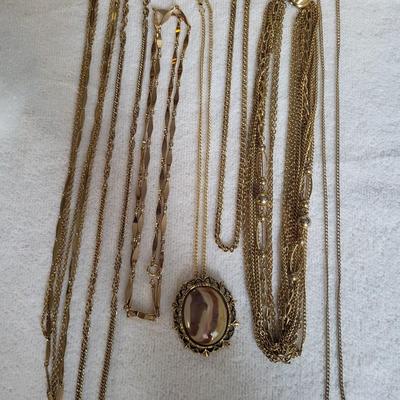7 GOLD TONE NECKLACES