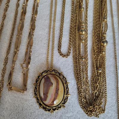 7 GOLD TONE NECKLACES