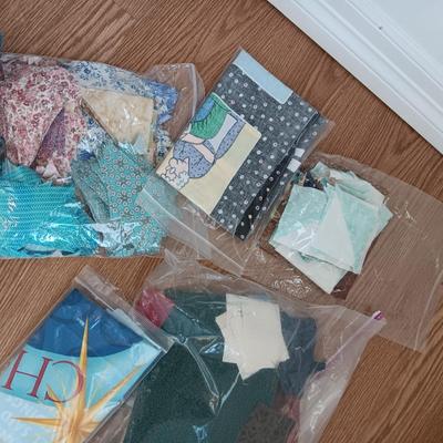 SCRAPS OF SEWING MATERIAL AND TABLE RUNNERS