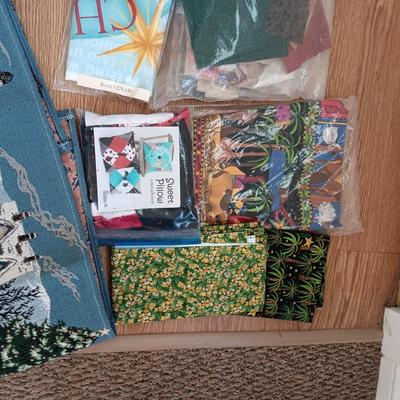 SCRAPS OF SEWING MATERIAL AND TABLE RUNNERS