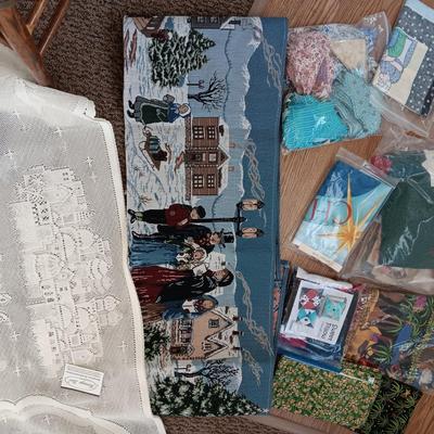 SCRAPS OF SEWING MATERIAL AND TABLE RUNNERS