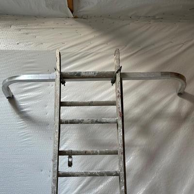 VERY TALL ALUMINUM EXTENSION LADDER WITH WALL SUPPORT