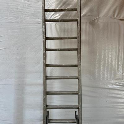 VERY TALL ALUMINUM EXTENSION LADDER WITH WALL SUPPORT