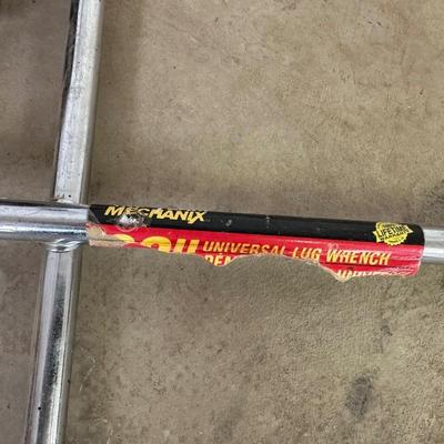 3 TON FLOOR JACK AND A 4 WAY LUG WRENCH