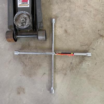 3 TON FLOOR JACK AND A 4 WAY LUG WRENCH