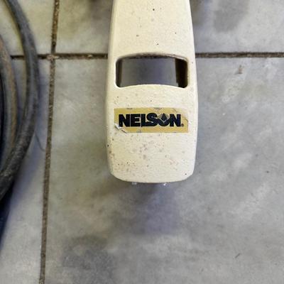 TRACTOR SPRINKLER AND A GARDEN HOSE