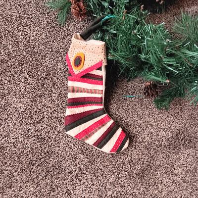 LIGHTED GARLAND WITH PINECONES AND STOCKINGS
