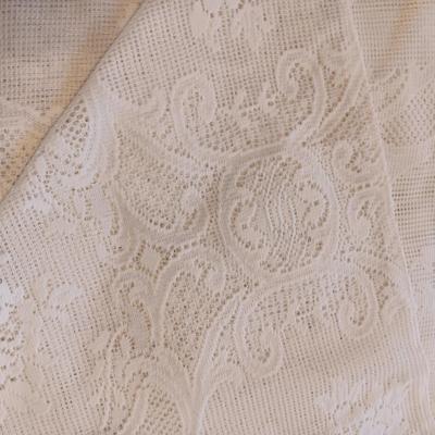 LARGE RECTANGLE LACEY TABLECLOTH AND SEVERAL DOILIES