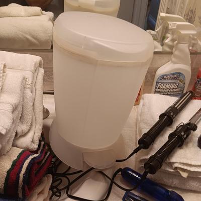 TOWELS, TOILETRIES, CLEANERS AND CURLING IRONS