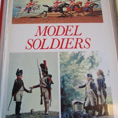4 military books, 1 formula 1 cars book