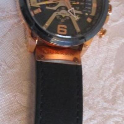 Sale Photo Thumbnail #288: date, second hand, water resistant up to 10M, black & gold, see pictures