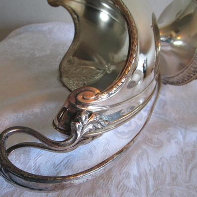 Silver-plated serving piece R173 with feet 9" tall x 15-1/2" handle to handle, insert is glass