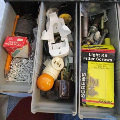 Metal parts cabinet with various hardware in 15 drawers