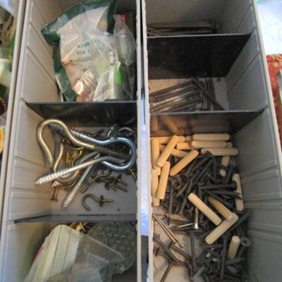 Metal parts cabinet with various hardware in 15 drawers