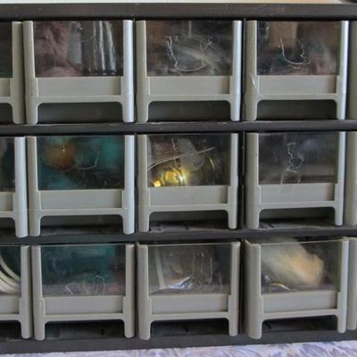 Metal parts cabinet with various hardware in 15 drawers