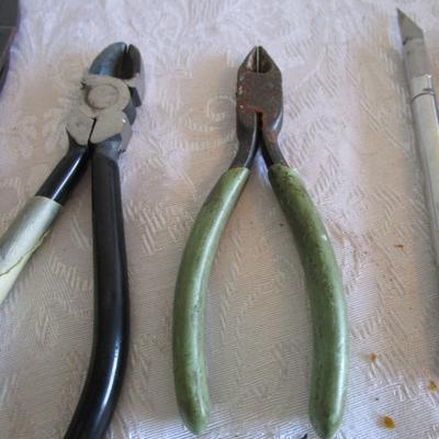 Dykes, box cutters, exacto knife